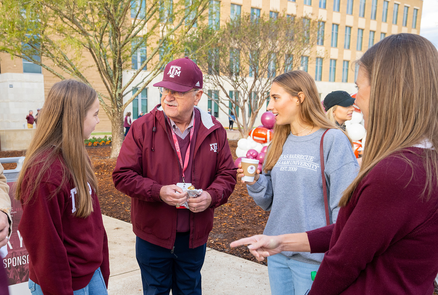 students talking during a tailgate