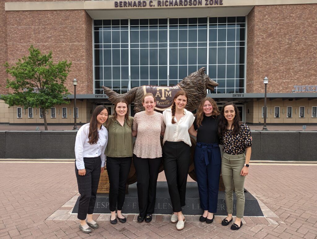 Six DI inters stand in front of the Reveille statue at Kyle Field